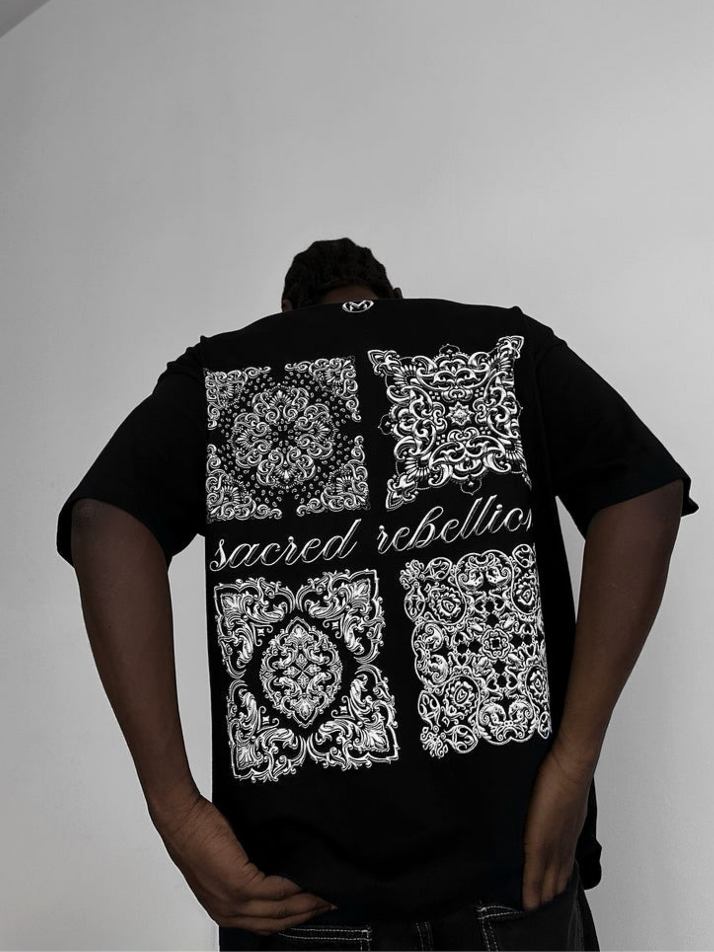 SACRED REBELLION TEE